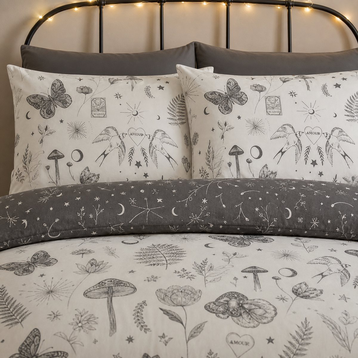 Close-up of Celeste Polycotton Duvet Cover Set in grey pillowcases showing the print and fabric detail