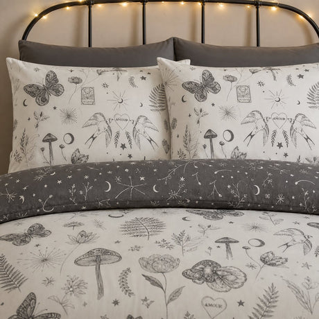 Close-up of Celeste Polycotton Duvet Cover Set in grey pillowcases showing the print and fabric detail