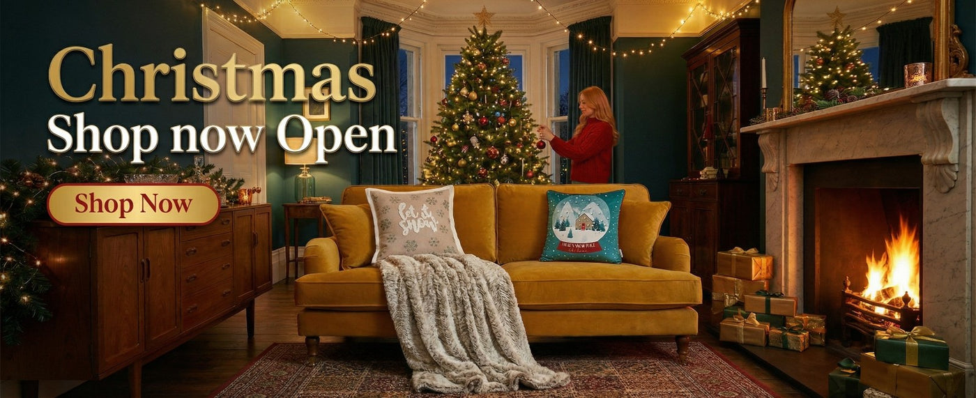 Living room with Christmas decorations, including a tree and fireplace, with promotional text for a Christmas shop.
