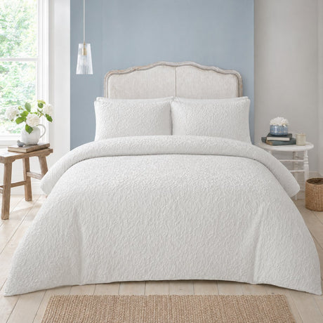 Collier white jacquard floral duvet cover set styled on a fresh bright bedroom bed