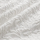 Macro close-up of the white Collier jacquard floral duvet cover fabric texture