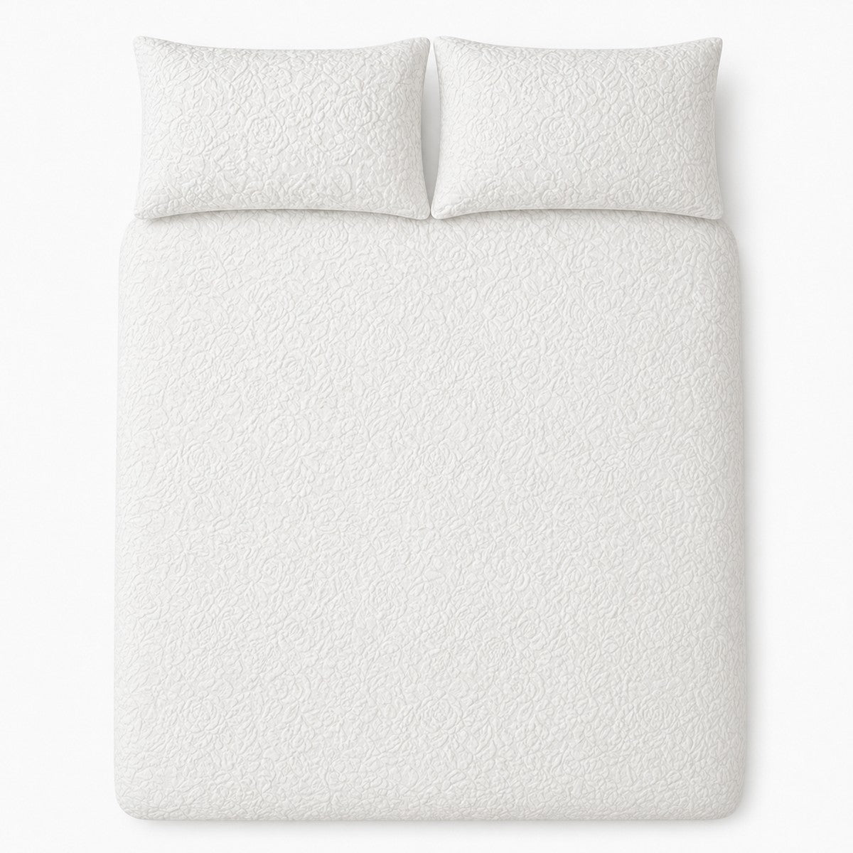 Overhead flat lay of the white Collier jacquard floral duvet cover set with two pillows