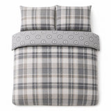 Overhead flat lay of the Colville Check grey duvet cover set with two matching pillowcases