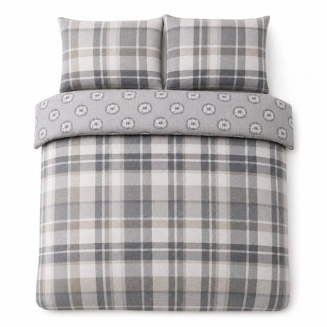 Overhead flat lay of the Colville Check grey duvet cover set with two matching pillowcases