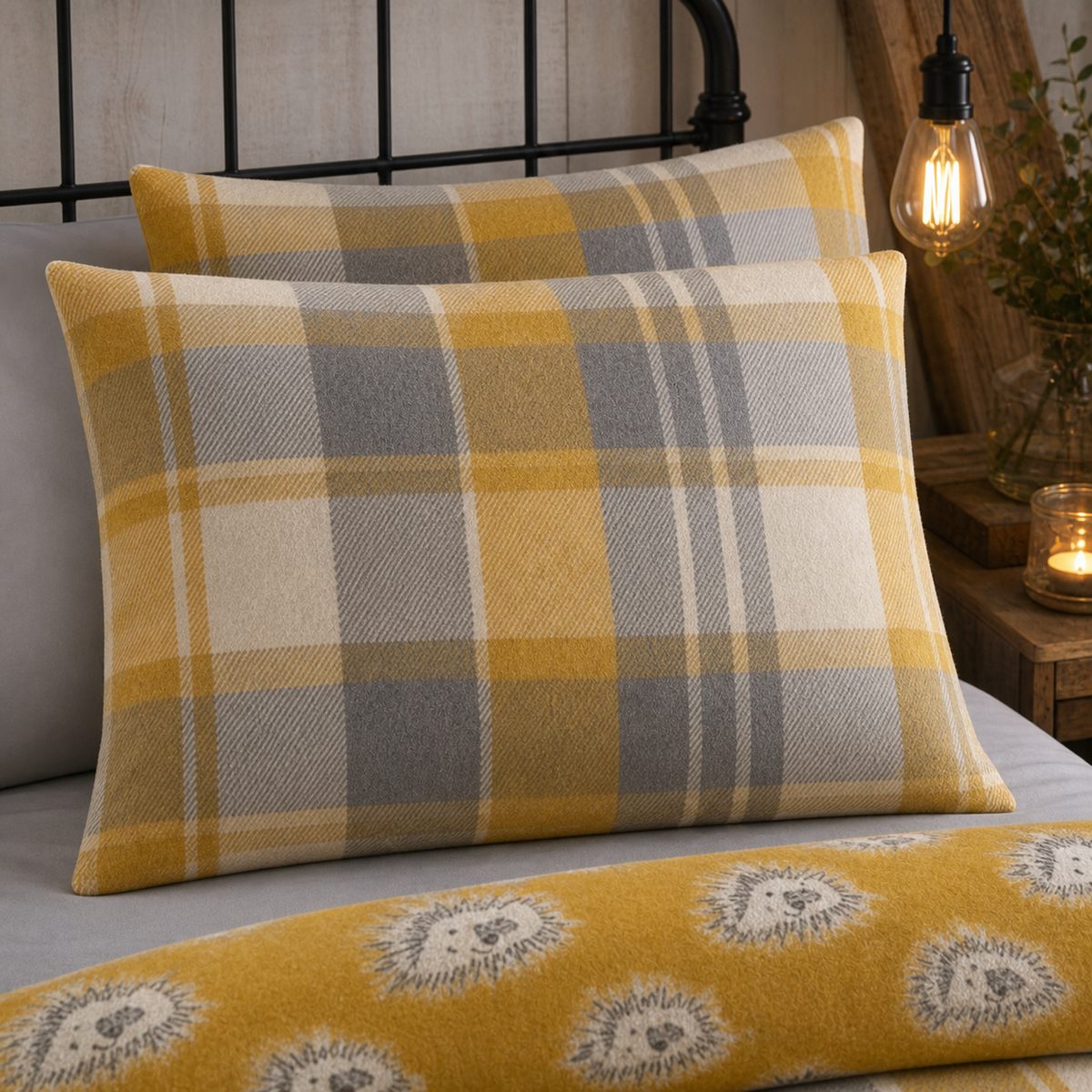 Close-up of Colville Check ochre brushed cotton pillowcases showing the tartan pattern