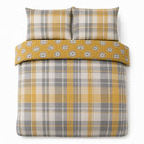 Overhead flat lay of the Colville Check ochre duvet cover set with two matching pillowcases