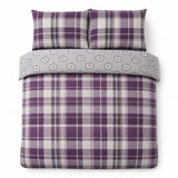 Overhead flat lay of the Colville Check plum duvet cover set with two matching pillowcases