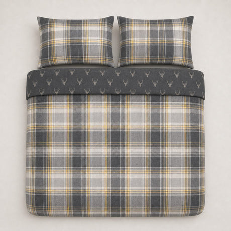 Overhead flat lay of the Connolly charcoal check duvet cover set with two matching pillowcases