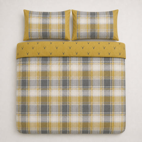 Overhead flat lay of the Connolly ochre check duvet cover set with two matching pillowcases