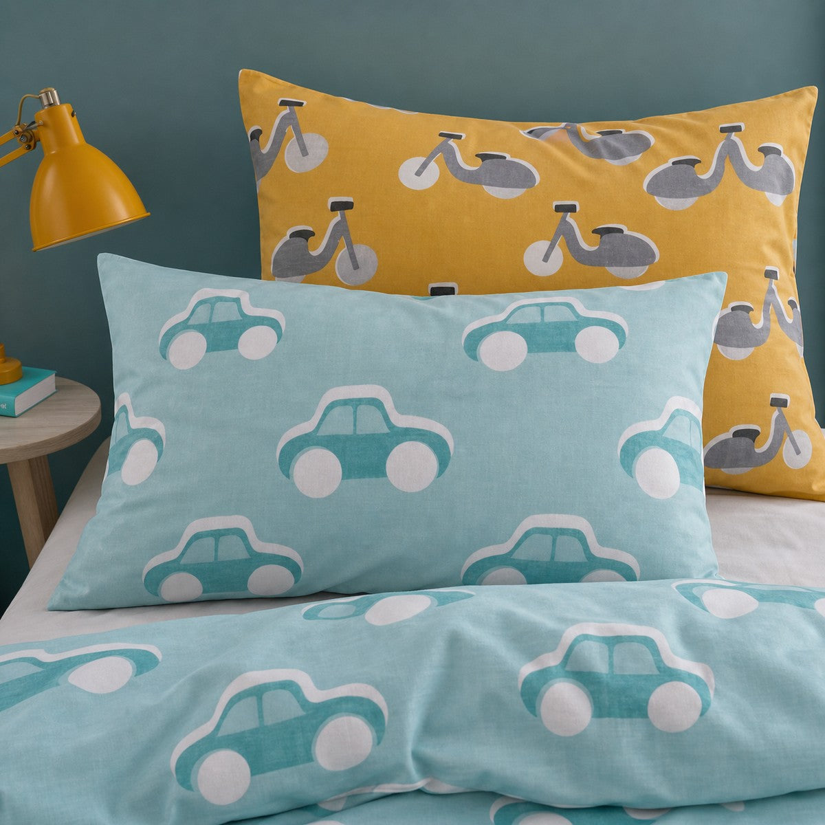 Close-up of matching Cool Cars Reversible Kids Single Duvet Cover Set pillowcases showing the pattern and fabric detail