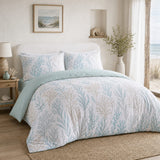Cora sea foam recycled polyester duvet cover set styled on a calm coastal bedroom bed