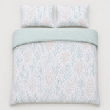 Overhead flat lay of the Cora sea foam duvet cover set with two pillows