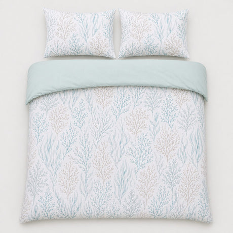 Overhead flat lay of the Cora sea foam duvet cover set with two pillows