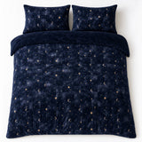 Overhead flat lay of the Cosmic Star Cosy Microfibre Duvet Cover Set in navy with two matching pillowcases