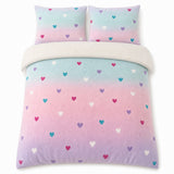Overhead flat lay of the Cosy Ombre Heart Kids Duvet Cover Set with two matching pillowcases