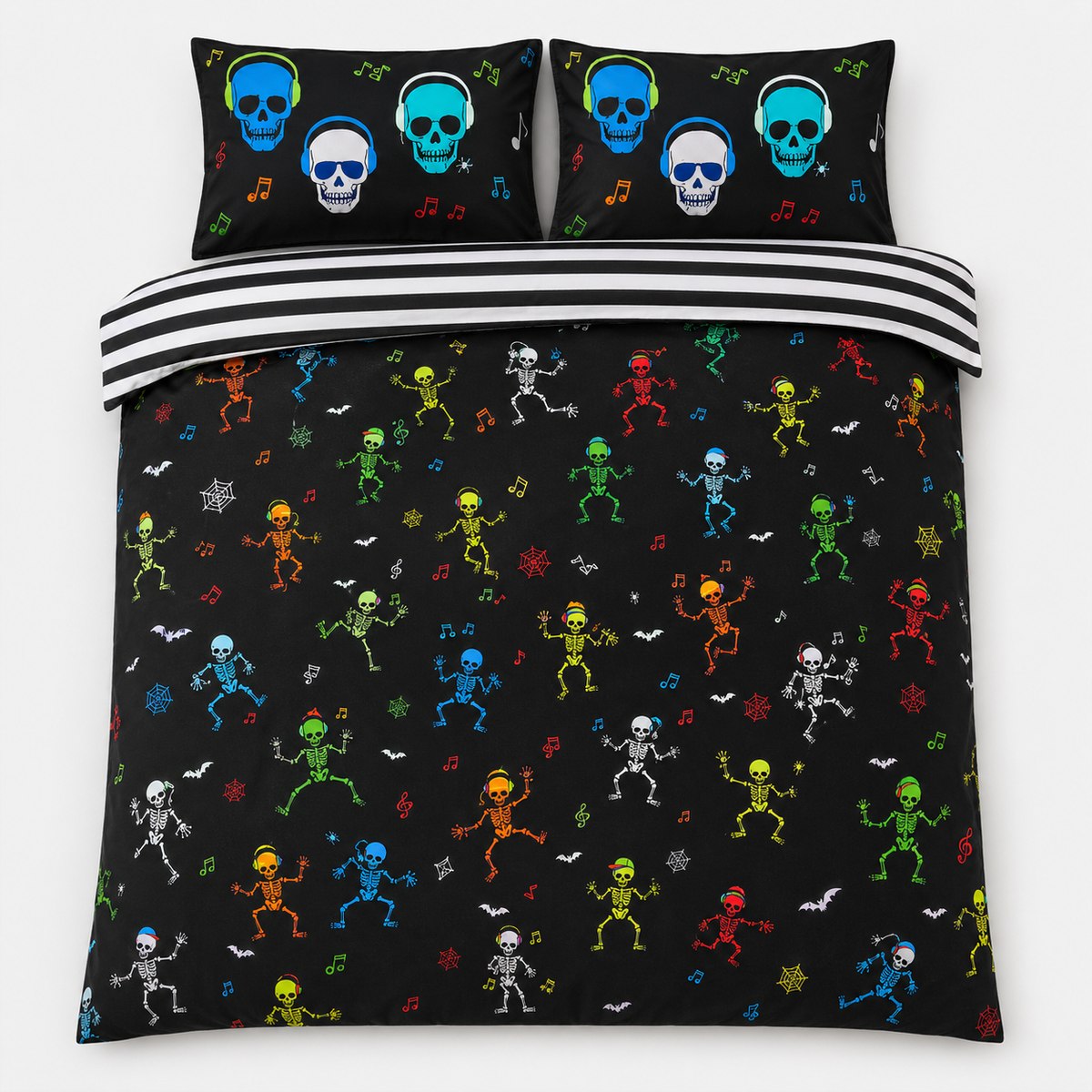 Overhead flat lay of the Dancing Skeletons Halloween duvet cover set with striped reverse