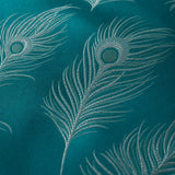 Macro close-up of the teal and silver Dandy jacquard polycotton peacock feather fabric