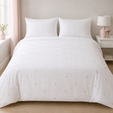 Decorative Heart Blush microfibre duvet cover set styled on a bright bedroom bed