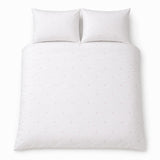 Overhead flat lay of the Decorative Heart Blush duvet cover set with two matching pillowcases