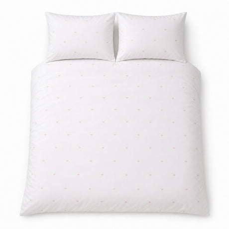 Overhead flat lay of the Decorative Heart Blush duvet cover set with two matching pillowcases