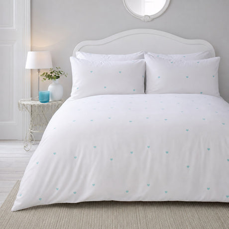 Decorative Heart Duck Egg microfibre duvet cover set styled on a bright bedroom bed