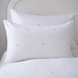 Close-up of Decorative Heart Duck Egg pillowcases with tiny duck egg blue heart motifs
