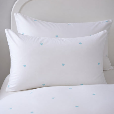 Close-up of Decorative Heart Duck Egg pillowcases with tiny duck egg blue heart motifs