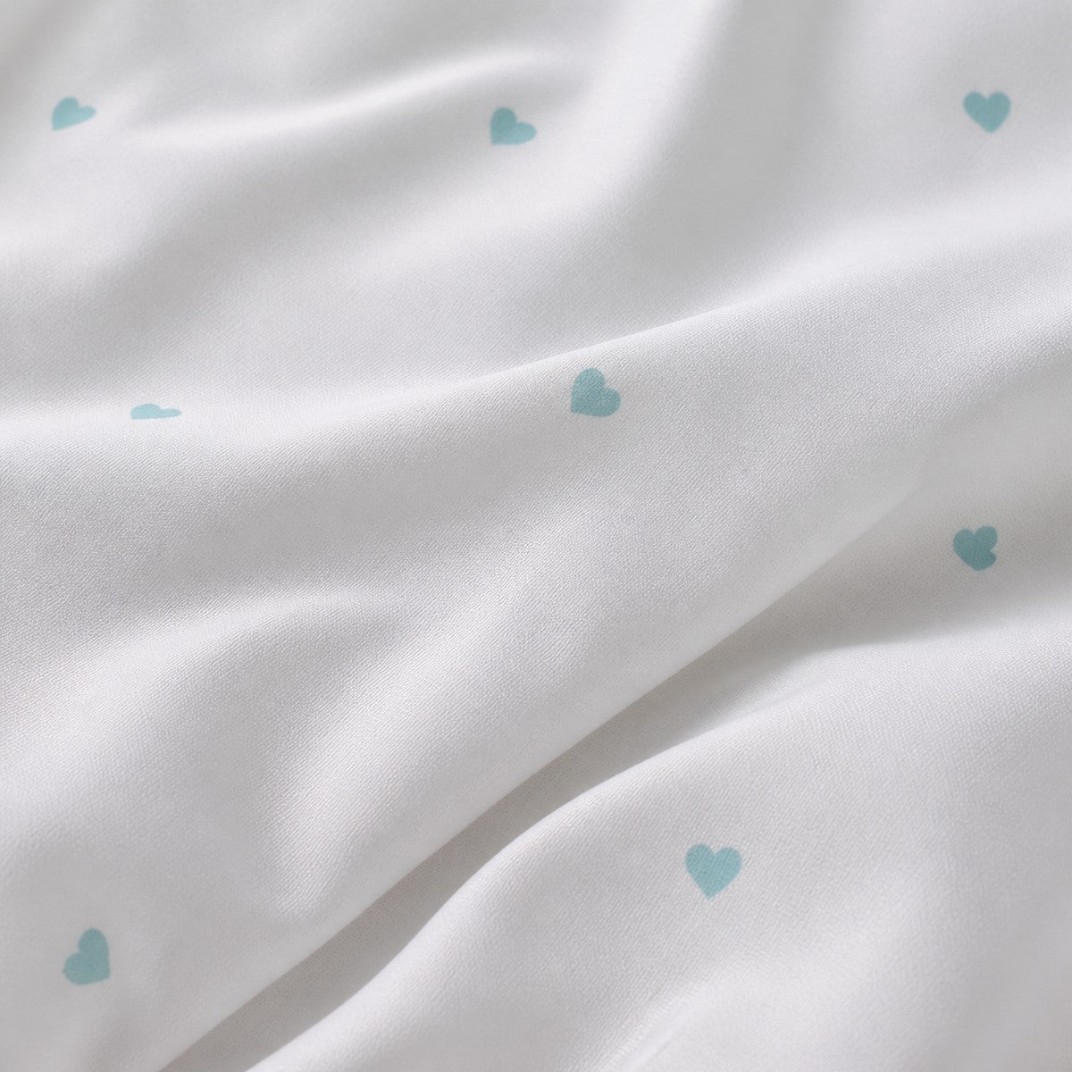 Macro close-up of the smooth Decorative Heart Duck Egg microfibre fabric