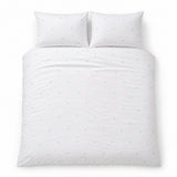Overhead flat lay of the Decorative Heart Duck Egg duvet cover set with two matching pillowcases