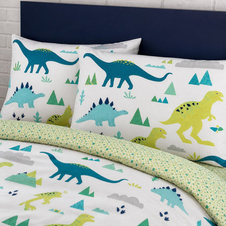 Close-up of matching Dino Dinosaur Kids Reversible Duvet Cover Set pillowcases showing the pattern and fabric detail