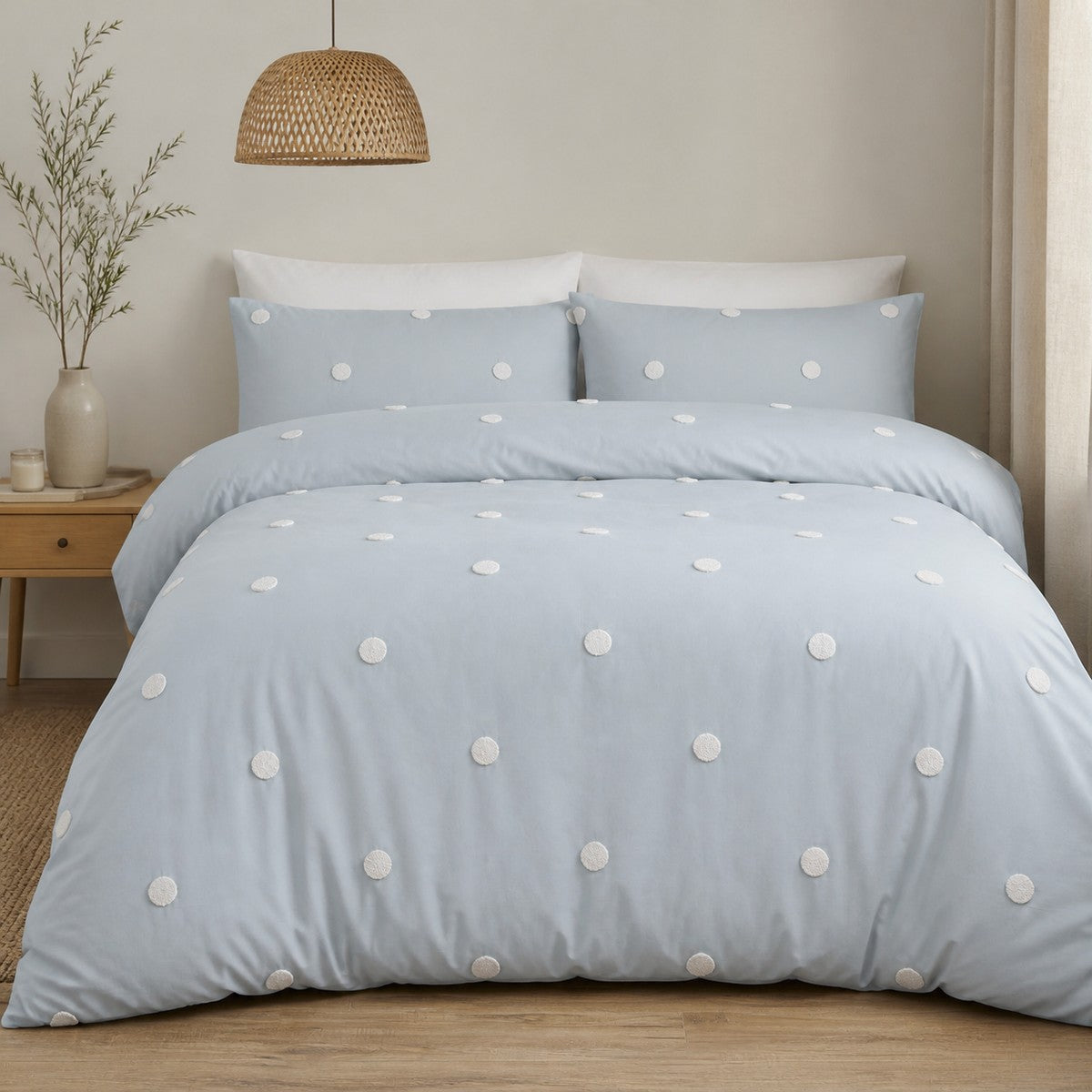 Dot Garden duck egg cotton duvet cover set styled on a calm bedroom bed