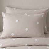 Close-up of Dot Garden Cotton Duvet Cover Set in linen pillowcases showing the print and fabric detail