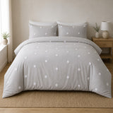 Dot Garden Cotton Duvet Cover Set in silver styled on a coordinated bedroom bed