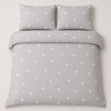 Overhead flat lay of the Dot Garden Cotton Duvet Cover Set in silver with two matching pillowcases