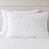 Close-up of Dot Garden Cotton Duvet Cover Set in white pillowcases showing the print and fabric detail