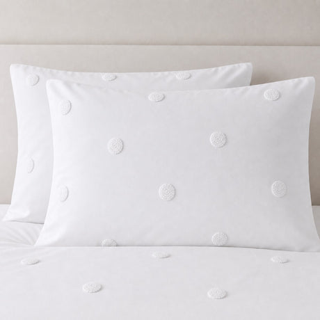 Close-up of Dot Garden Cotton Duvet Cover Set in white pillowcases showing the print and fabric detail