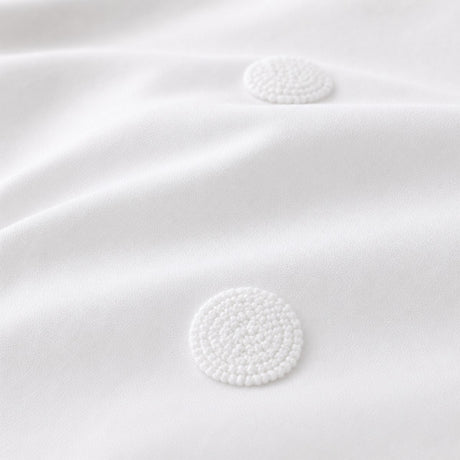 Macro close-up of the white fabric on the Dot Garden Cotton Duvet Cover Set
