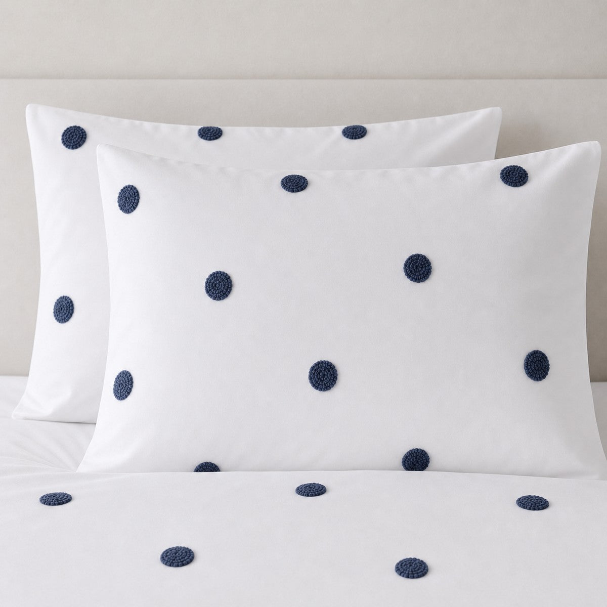 Close-up of Dot Garden Cotton Duvet Cover Set in white + navy pillowcases showing the print and fabric detail