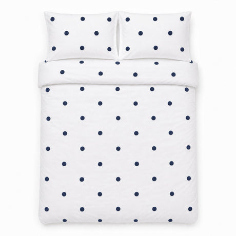 Overhead flat lay of the Dot Garden Cotton Duvet Cover Set in white + navy with two matching pillowcases