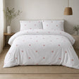 Dot Garden Cotton Duvet Cover Set in white + pink styled on a coordinated bedroom bed