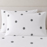 Close-up of Dot Garden Cotton Duvet Cover Set in white + slate pillowcases showing the print and fabric detail