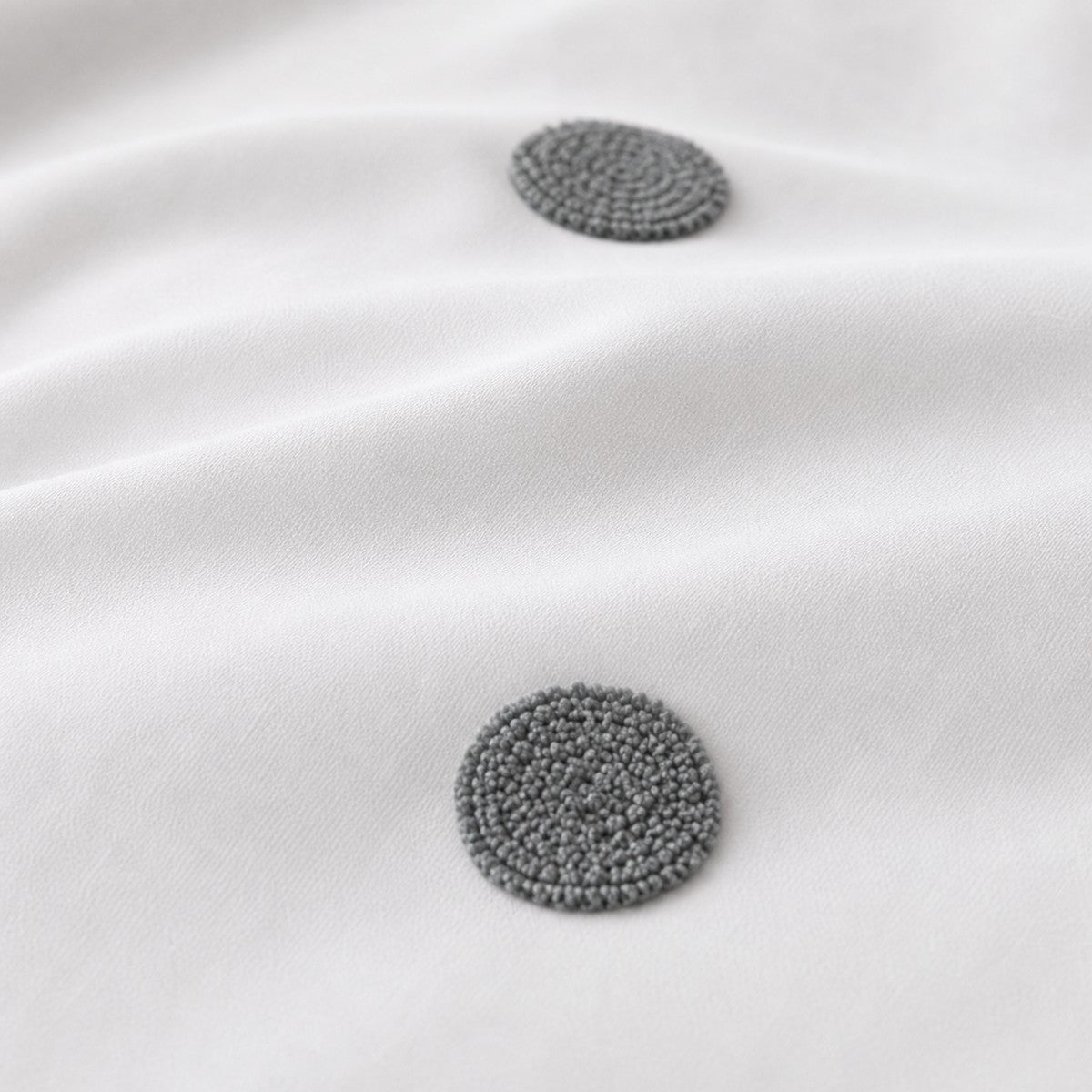 Macro close-up of the white + slate fabric on the Dot Garden Cotton Duvet Cover Set