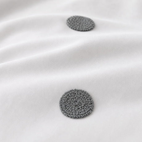 Macro close-up of the white + slate fabric on the Dot Garden Cotton Duvet Cover Set