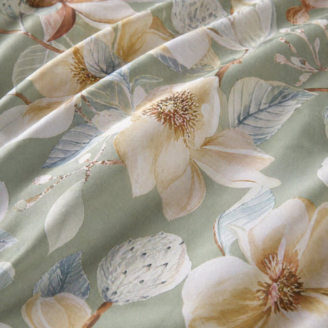 Macro close-up of the Eleanor green floral cotton sateen duvet cover fabric