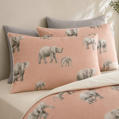 Close-up of Ella the Elephant pillowcases showing grey elephant print on blush peach fabric