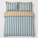 Overhead flat lay of the Eloise Stripe Cotton Duvet Cover Set in teal with two matching pillowcases