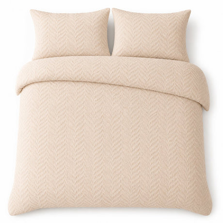 Overhead flat lay of the Embossed Curve Microfibre Duvet Cover Set in natural with two matching pillowcases