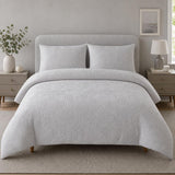 Embossed Geo Microfibre Duvet Cover Set in grey styled on a coordinated bedroom bed