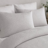 Close-up of Embossed Geo Microfibre Duvet Cover Set in grey pillowcases showing the print and fabric detail
