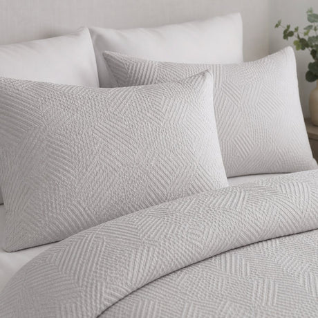 Close-up of Embossed Geo Microfibre Duvet Cover Set in grey pillowcases showing the print and fabric detail